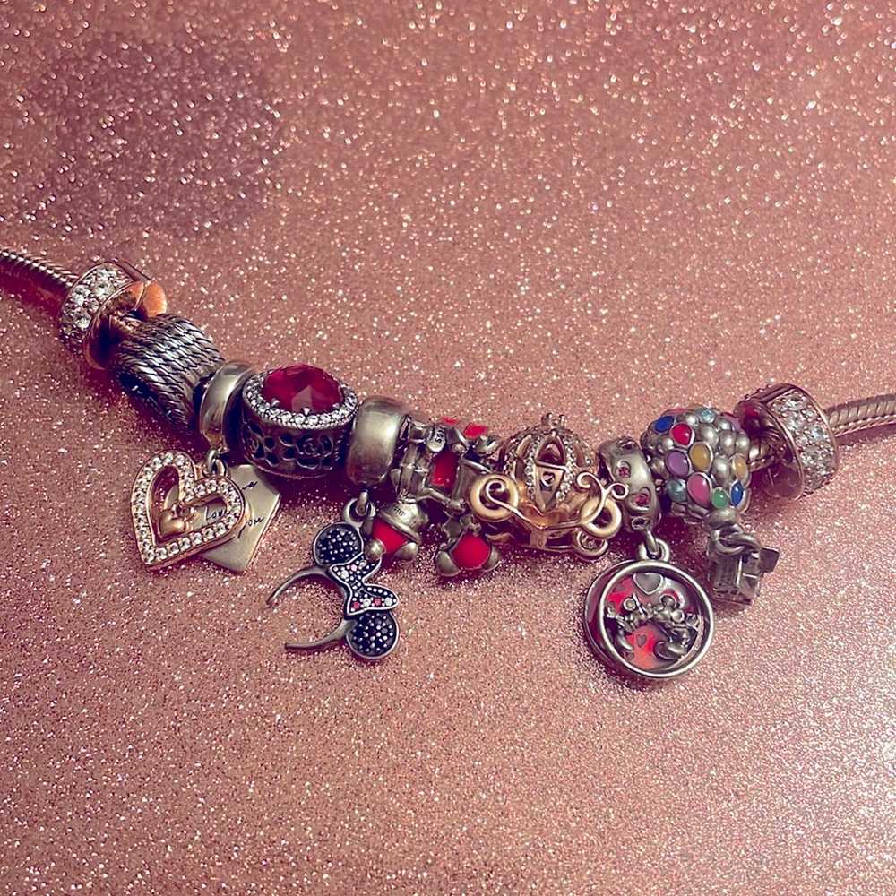 Authentic pandora bracelet with 8 charms and 2 spacers mostly Disney charms